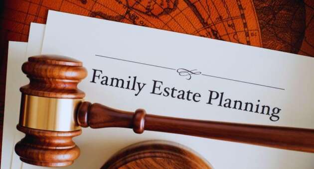 Wooden judge’s gavel resting on a legal document titled ‘Family Estate Planning’ against a vintage world map background, representing legal guidance for family estate planning.